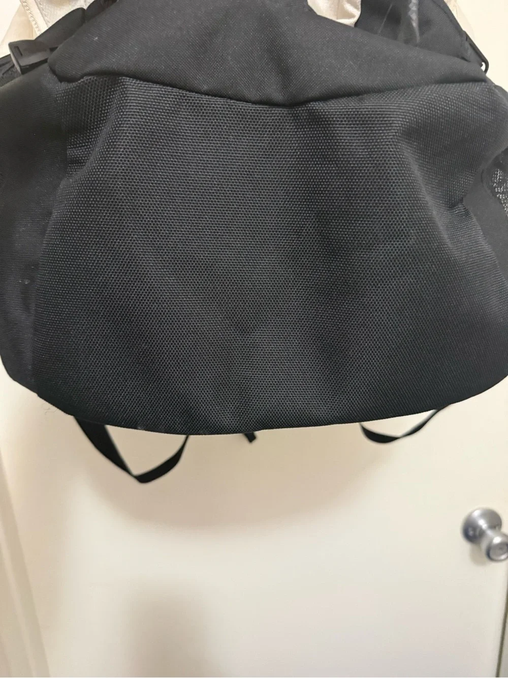 The North Face Two-Tone Beige and Black Backpack with Bungee Front